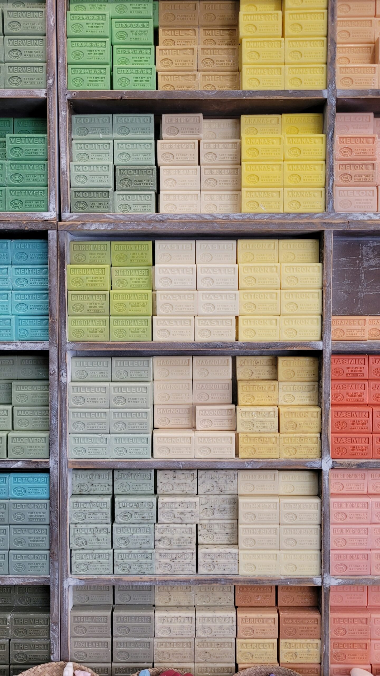 a shelf filled with lots of different colored bricks